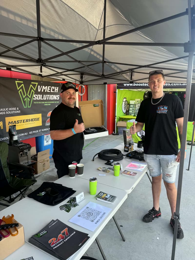 VMECH Solutions at a trade stand, 24/7 catalogue on the table
