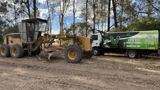 On-site hydraulic hose repair beside a grader on a Sunshine Coast job